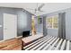Bright bedroom featuring a vaulted ceiling, modern ceiling fan, and hardwood-style flooring at 2306 63Rd W St # 40, Bradenton, FL 34209