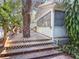 Outdoor wooden deck and stairs showcasing the railings and tree feature at 2306 63Rd W St # 40, Bradenton, FL 34209