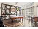 Entertaining game room features a pool table, custom shelving, and bright natural light at 2306 63Rd W St # 40, Bradenton, FL 34209