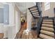 Hallway featuring a staircase and views into other living spaces at 2306 63Rd W St # 40, Bradenton, FL 34209