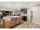 Stylish kitchen with stainless steel appliances, granite countertops, and view into the living area at 2306 63Rd W St # 40, Bradenton, FL 34209