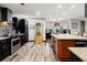 Spacious kitchen with stainless steel appliances, granite countertops, and wood-look tile flooring at 2306 63Rd W St # 40, Bradenton, FL 34209