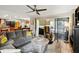 Bright living room with wood-look floors, a comfortable sofa, and access to a screened-in patio at 2306 63Rd W St # 40, Bradenton, FL 34209