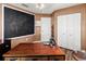 Well-lit office featuring a large chalkboard and ample workspace with a sleek wooden desk at 2306 63Rd W St # 40, Bradenton, FL 34209
