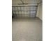 Spacious garage with epoxy flooring and ample space for parking and storage at 24779 Buckingham Way, Port Charlotte, FL 33980