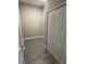 Functional storage room with tiled floor, white wire rack shelf and a large bifold closet at 24779 Buckingham Way, Port Charlotte, FL 33980