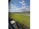 Beautiful view of the golf course and surrounding landscape from this home's window at 24779 Buckingham Way, Port Charlotte, FL 33980