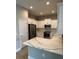 Stylish kitchen with white cabinets, stainless steel appliances, and quartz countertops at 24831 Buckingham Way, Port Charlotte, FL 33980