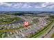 Wide aerial shot illustrating the community's ponds, homes, landscaping, and overall neighborhood appeal at 2625 Star Apple Way, Sarasota, FL 34240