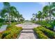 Tranquil community hot tub surrounded by palm trees and colorful tropical foliage at 2625 Star Apple Way, Sarasota, FL 34240
