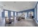 A communal kitchen and meeting area features a long island, modern decor and furnishings at 2625 Star Apple Way, Sarasota, FL 34240