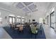 Community lounge area with ample seating, large windows, and modern decorative touches at 2625 Star Apple Way, Sarasota, FL 34240