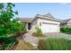 Charming single-story home with a well-manicured lawn, paver walkway and a two-car garage at 2625 Star Apple Way, Sarasota, FL 34240