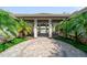 Beautiful pool lounge area with seating and tropical landscaping at 2625 Star Apple Way, Sarasota, FL 34240
