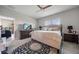 Inviting main bedroom with comfortable king bed, neutral décor, and a view into the home at 2625 Star Apple Way, Sarasota, FL 34240