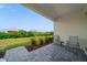 Charming patio with neutral furniture overlooking landscaped backyard at 2625 Star Apple Way, Sarasota, FL 34240