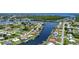 Expansive aerial view showcasing waterfront homes along a canal community at 264 E Tarpon Nw Blvd, Port Charlotte, FL 33952
