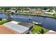 An overhead shot of this property, it's boat lift, and nearby waterways offers serene views at 264 E Tarpon Nw Blvd, Port Charlotte, FL 33952