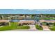 Aerial view of a waterfront property with lush landscaping and beautiful neighborhood surroundings at 264 E Tarpon Nw Blvd, Port Charlotte, FL 33952