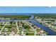Overhead view shows waterfront homes, canals and waterways leading to the ocean at 264 E Tarpon Nw Blvd, Port Charlotte, FL 33952