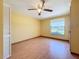Sunny bedroom with laminate floors and a view from the window at 264 E Tarpon Nw Blvd, Port Charlotte, FL 33952