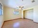 Bedroom with laminate floors, closet, a window for natural light and a ceiling fan at 264 E Tarpon Nw Blvd, Port Charlotte, FL 33952