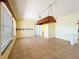 Open dining area with tile flooring, natural light, and an ornate chandelier at 264 E Tarpon Nw Blvd, Port Charlotte, FL 33952