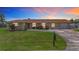 Charming single-story home with a well-maintained lawn and inviting curb appeal at 264 E Tarpon Nw Blvd, Port Charlotte, FL 33952