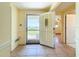 Inviting foyer with tile flooring and a view to the exterior, seamlessly connecting indoor and outdoor spaces at 264 E Tarpon Nw Blvd, Port Charlotte, FL 33952