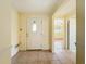 Welcoming foyer with neutral tile flooring and ample natural light, showcasing a bright entrance at 264 E Tarpon Nw Blvd, Port Charlotte, FL 33952