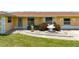 Inviting single-story home featuring a well-maintained front yard and dolphin statues at 264 E Tarpon Nw Blvd, Port Charlotte, FL 33952