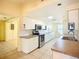 Bright kitchen with white cabinetry and a neutral counter top at 264 E Tarpon Nw Blvd, Port Charlotte, FL 33952