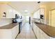 Galley style kitchen features white cabinets and stainless steel appliances at 264 E Tarpon Nw Blvd, Port Charlotte, FL 33952
