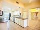 Well-lit kitchen with white cabinetry and stainless steel appliances at 264 E Tarpon Nw Blvd, Port Charlotte, FL 33952