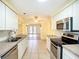 A well-lit kitchen featuring stainless steel appliances, sink and lots of cabinets at 264 E Tarpon Nw Blvd, Port Charlotte, FL 33952