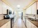 Updated kitchen with sleek stainless steel appliances and bright lighting at 264 E Tarpon Nw Blvd, Port Charlotte, FL 33952