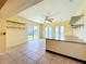 Bright kitchenette featuring a ceiling fan, tile flooring, and a view to the outdoor at 264 E Tarpon Nw Blvd, Port Charlotte, FL 33952