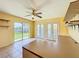 Bright kitchenette with a ceiling fan, tile flooring, and an open view to the outdoor at 264 E Tarpon Nw Blvd, Port Charlotte, FL 33952