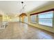 Bright living room with tile flooring, recessed lights, and canal views at 264 E Tarpon Nw Blvd, Port Charlotte, FL 33952