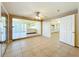 Open-concept living room with tile flooring, ceiling fan, and an open view to an outdoor patio at 264 E Tarpon Nw Blvd, Port Charlotte, FL 33952