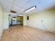 Spacious room with laminate floors and kitchenette in the background at 264 E Tarpon Nw Blvd, Port Charlotte, FL 33952