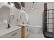Luxurious bathroom with double sinks, soaking tub, modern lighting, and a glass-enclosed shower at 318 39Th Ne St, Bradenton, FL 34208