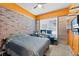 Bedroom with exposed brick and an abundance of natural light at 318 39Th Ne St, Bradenton, FL 34208