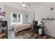 Cozy bedroom with wood floors, a ceiling fan, and a comfortable bed with floral bedding at 318 39Th Ne St, Bradenton, FL 34208