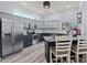 Bright kitchen with an island, stainless steel appliances, ample cabinet space, and an eat-in area at 318 39Th Ne St, Bradenton, FL 34208