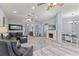 Open living room and dining area featuring modern decor, plenty of seating, and bright lighting at 318 39Th Ne St, Bradenton, FL 34208