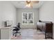 Office space with large window, desk, and storage at 318 39Th Ne St, Bradenton, FL 34208