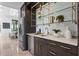 Interior bar area with marble countertops, wine storage, glass shelving and custom cabinetry at 3212 Signet Ct, Sarasota, FL 34240