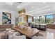 Elegant dining room features a large dining table, stylish chairs, and a modern chandelier at 3212 Signet Ct, Sarasota, FL 34240