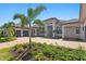 This single-story home features an attached garage, paver driveway, and meticulously maintained landscaping at 3212 Signet Ct, Sarasota, FL 34240